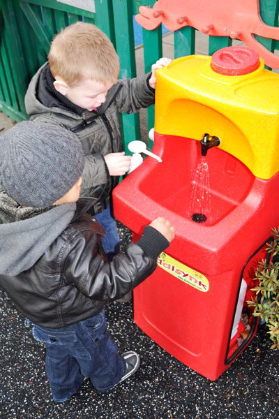 Children washing hands at nursery school