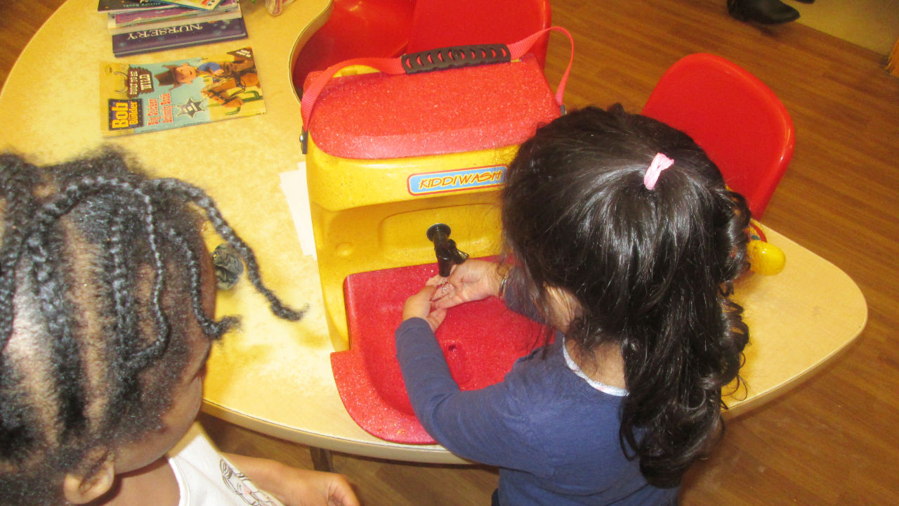 A Kiddiwash Xtra portable handwash unit being used in a preschool